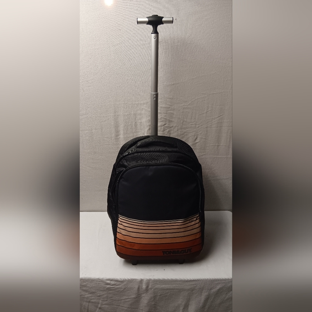 Toni & Guy rolling backpack